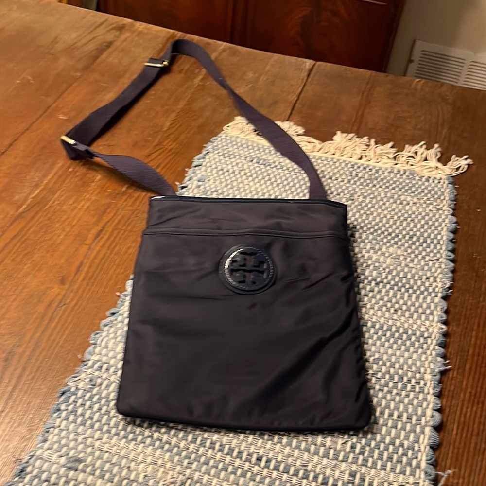 Tory Burch navy blue crossbody bag.